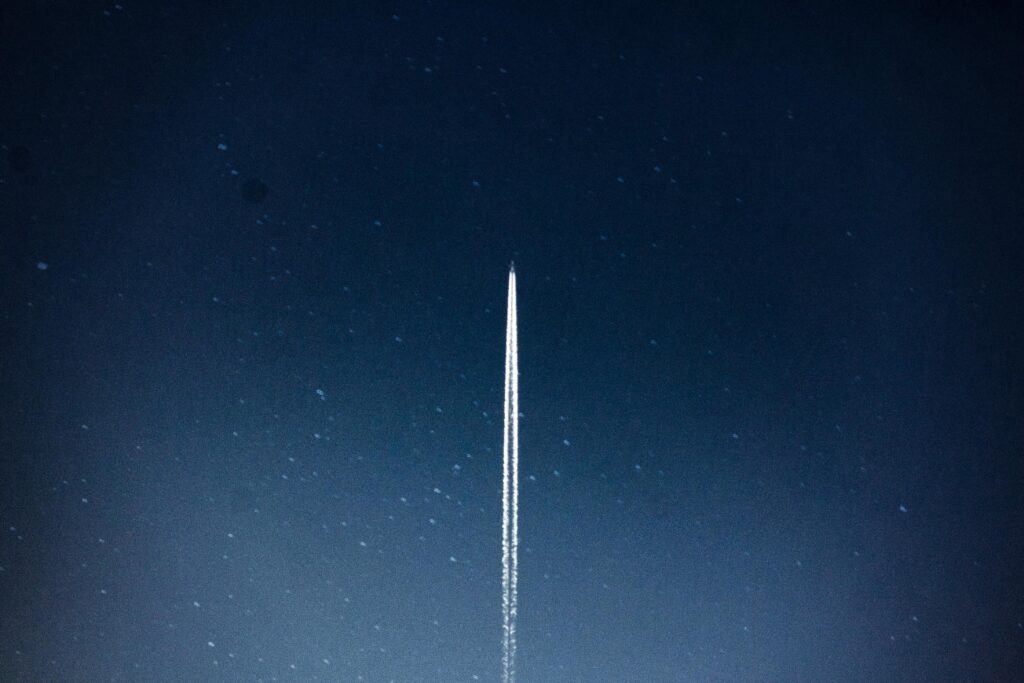 pexels-photo-796206-796206 A rocket streaks through a starry night, leaving a trail in outer space.